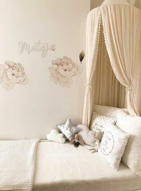 A serene nursery with soft light and calm neutral tones